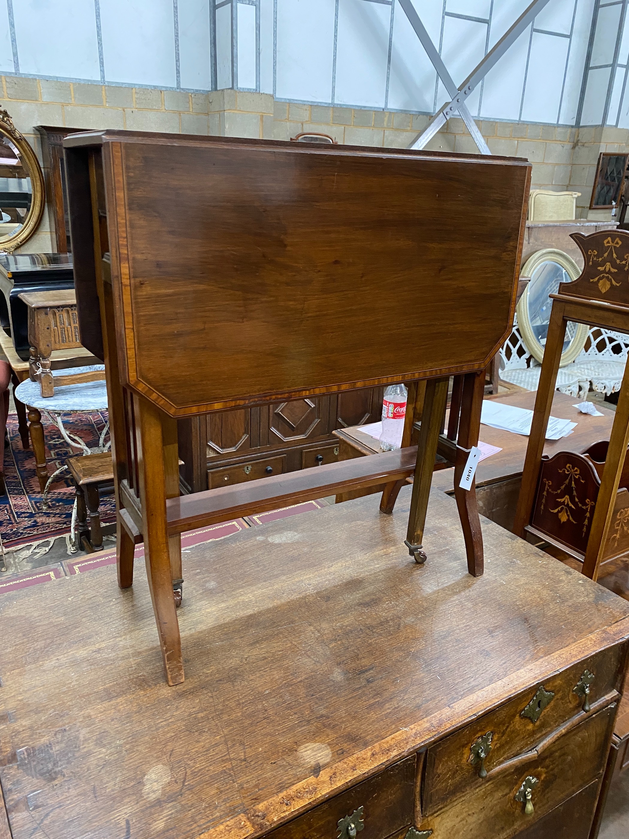 An Edwardian satinwood banded mahogany Sutherland table, width 60cm, depth 20cm, height 66cm